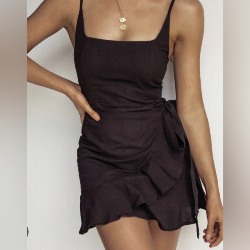 Princess Polly black mini wrap dress called the Kiribati dress